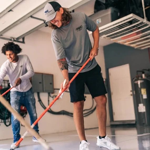 Top Quality Coating team installing epoxy flooring in a residential garage in Southwest Florida.