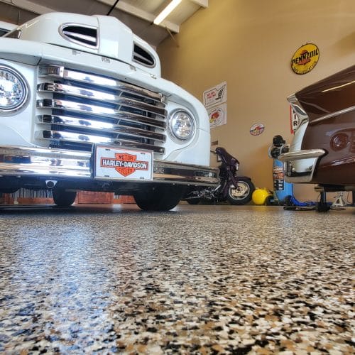Newly installed polyaspartic flake garage floor with a clean, seamless finish in Southwest Florida