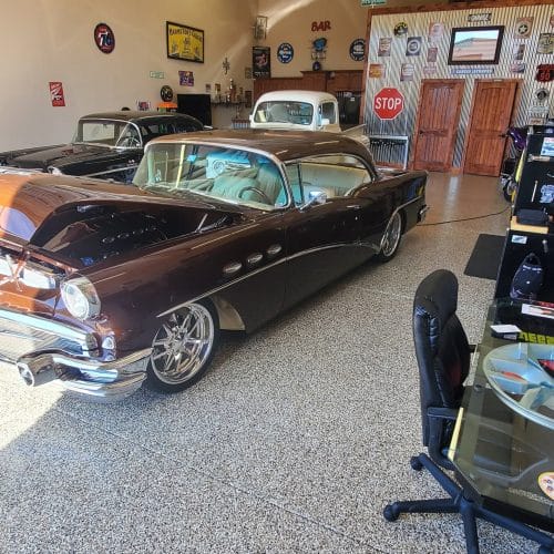Epoxy floor coating installed in a Naples, FL garage with a high-gloss flake finish.