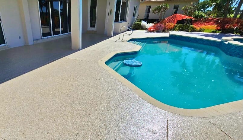Quartz epoxy flooring installation in Marco Island, FL by Top Quality Coating featuring slip-resistant, durable double broadcast epoxy flooring.